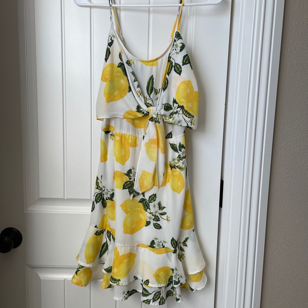 Lemon sundress with top tie and bottom ruffles